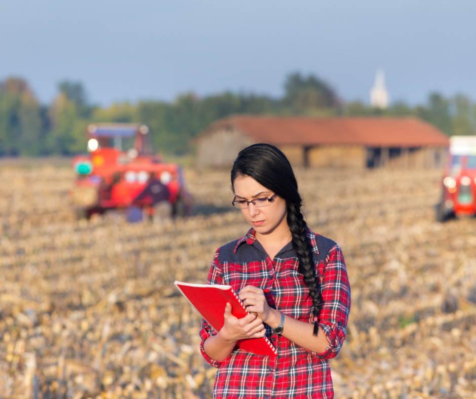 FarmSafe Promo Photo, woman looking at notebook