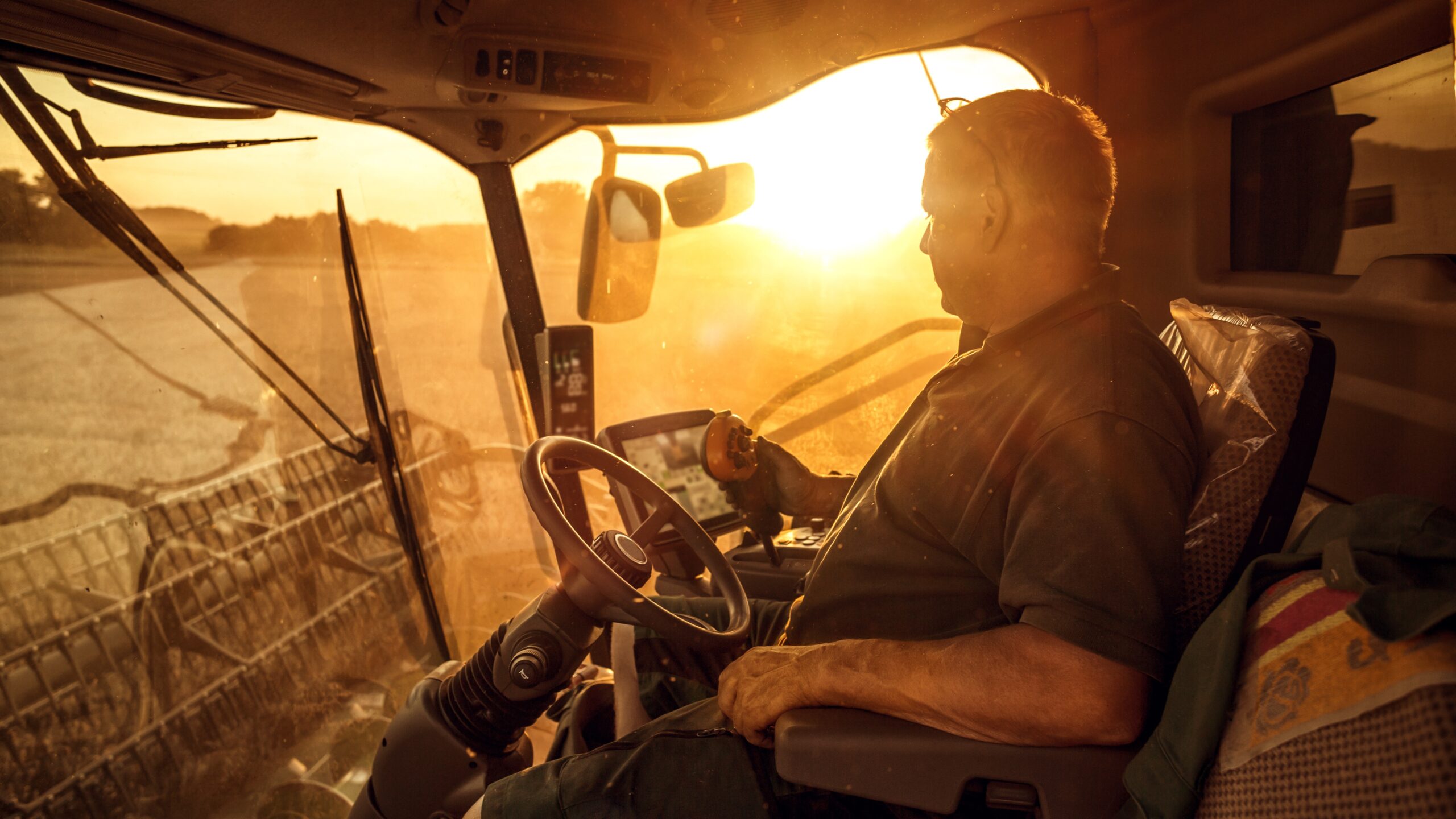 Photo of a farmer planting his field from a tractor.